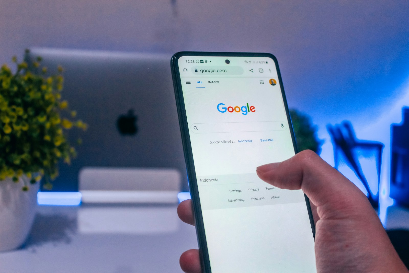 A person scrolling on Google on a smartphone